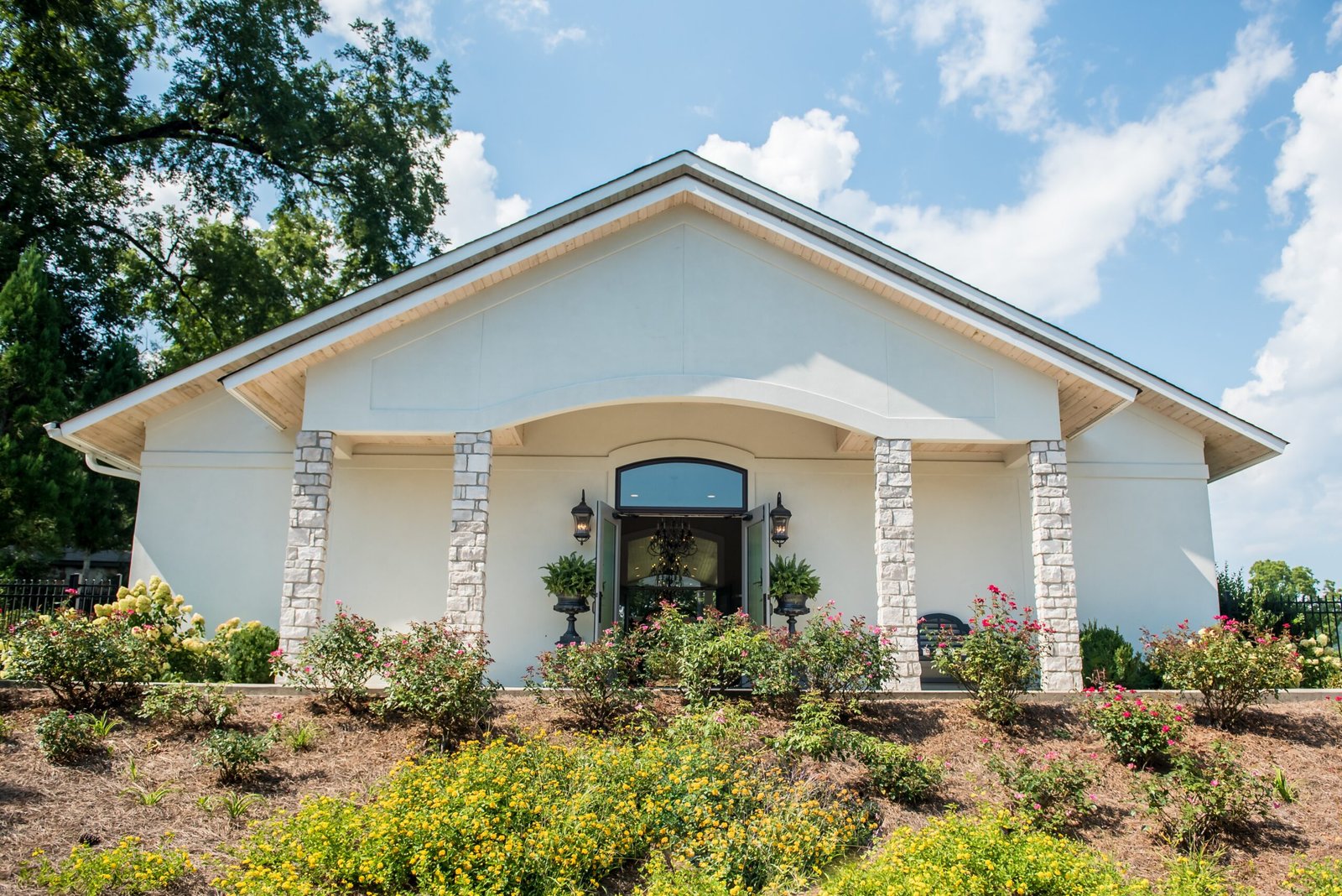 Stucco building stone pillars | Apex Garage