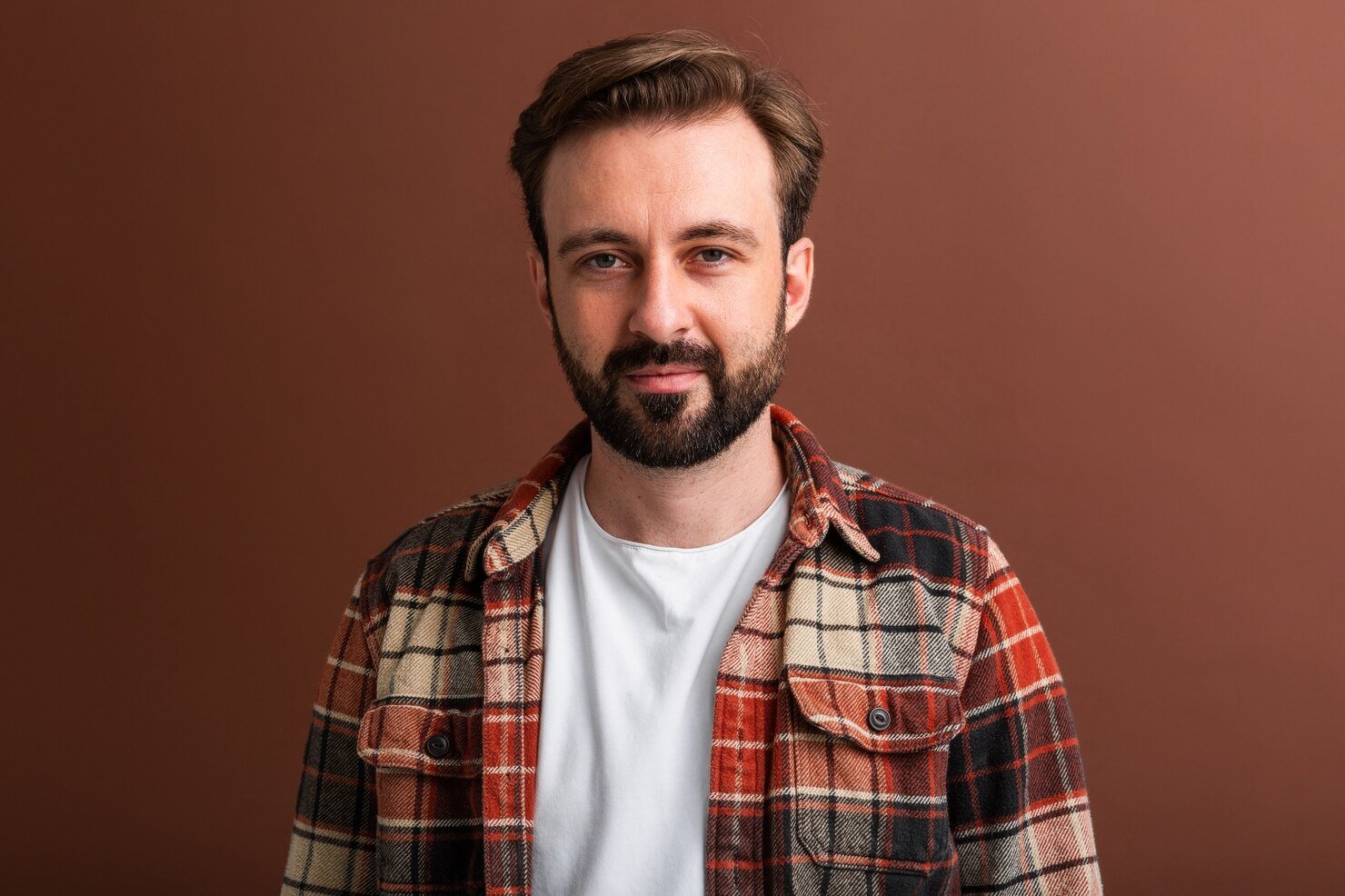 Bearded man wearing flannel | Apex Garage Conversions