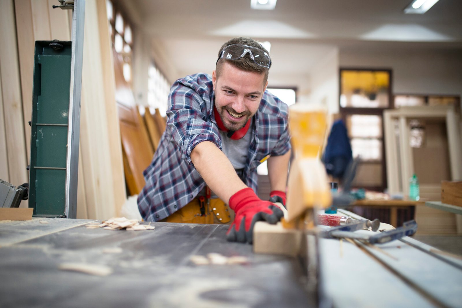 Carpenter using table saw | Apex Garage Conversions
